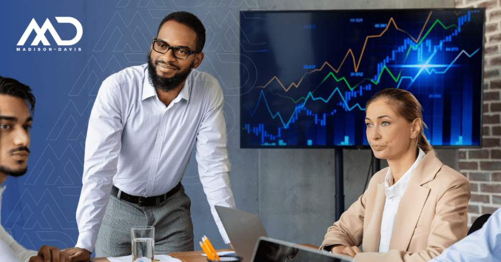 Investment advisers and asset managers in corporate attire meet around a conference table